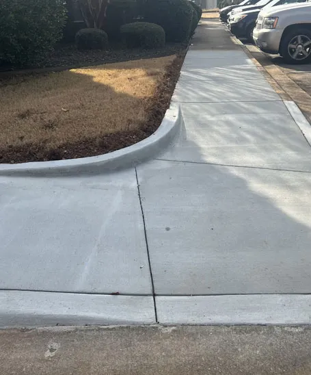 Curved concrete driveway extension with additional parking completed in Madison, AL